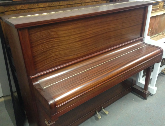 Marshall rose upright piano in a Mahogany cabinet.